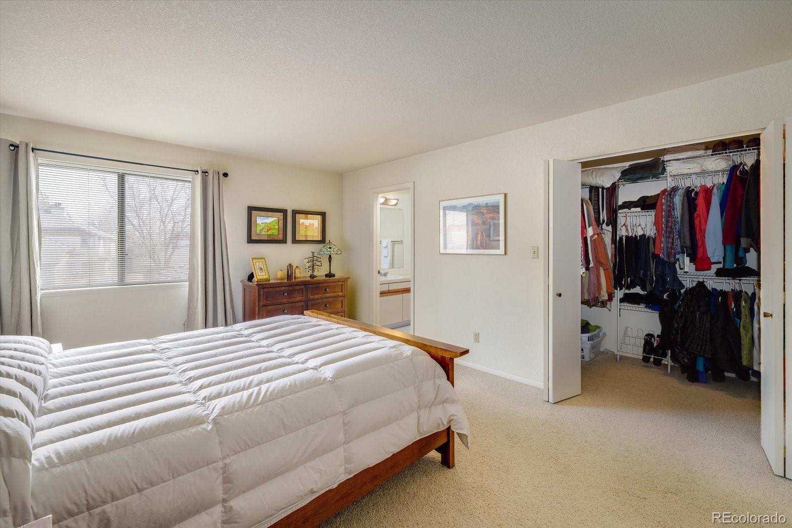 4635 Chestnut Lane, Unit 3 Boulder, CO 80301 - Photo 14 of 36 a bedroom with a bed and a window