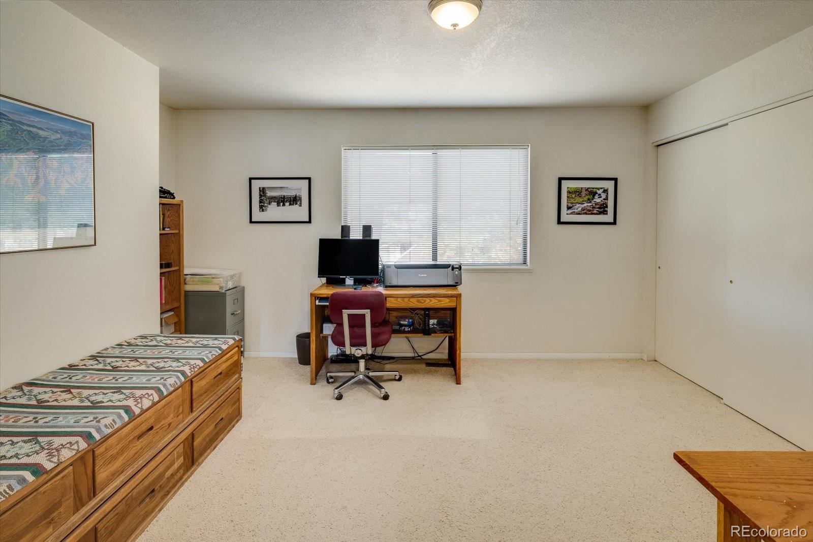 4635 Chestnut Lane, Unit 3 Boulder, CO 80301 - Photo 17 of 36 a view of a workspace with furniture and a window