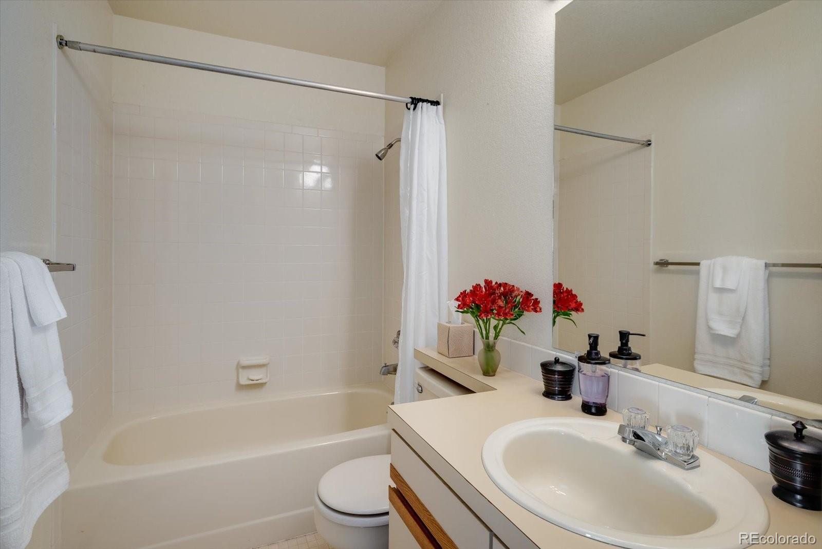 4635 Chestnut Lane, Unit 3 Boulder, CO 80301 - Photo 19 of 36 a bathroom with a sink toilet and shower