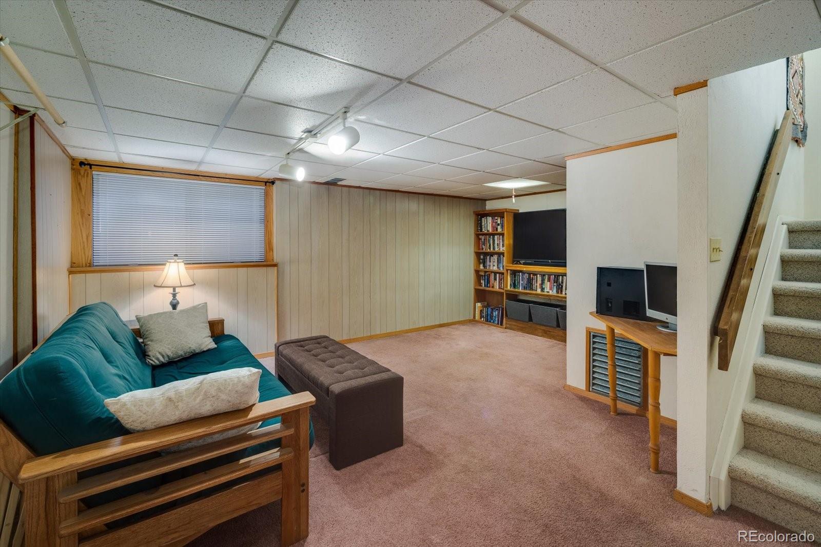4635 Chestnut Lane, Unit 3 Boulder, CO 80301 - Photo 20 of 36 a living room with furniture and a flat screen tv