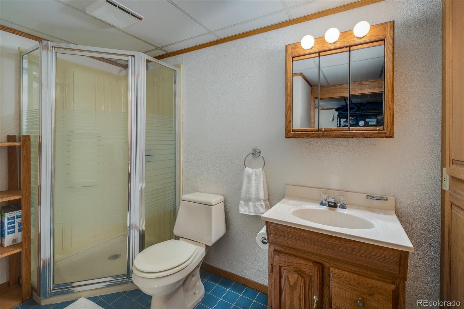 4635 Chestnut Lane, Unit 3 Boulder, CO 80301 - Photo 23 of 36 a bathroom with a toilet sink and mirror