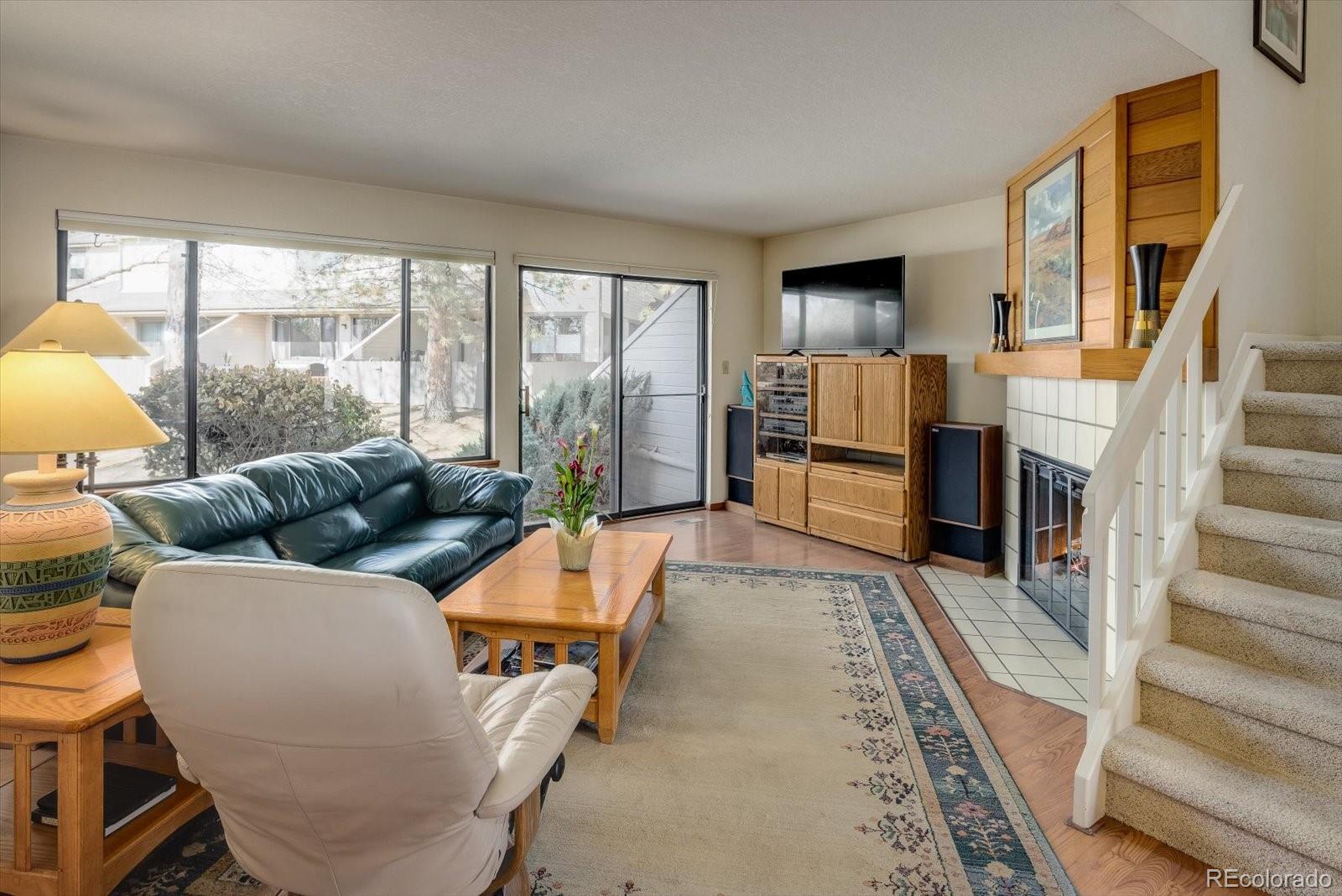 4635 Chestnut Lane, Unit 3 Boulder, CO 80301 - Photo 3 of 36 a living room with furniture and a fireplace