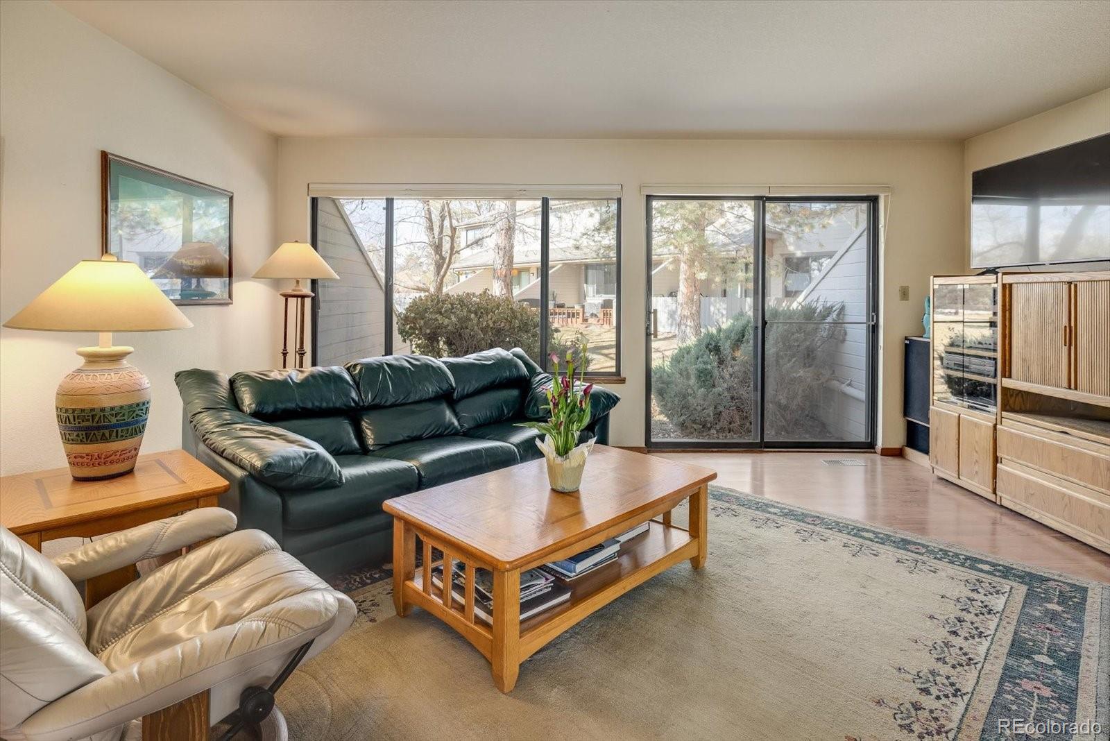 4635 Chestnut Lane, Unit 3 Boulder, CO 80301 - Photo 4 of 36 a living room with furniture and a large window
