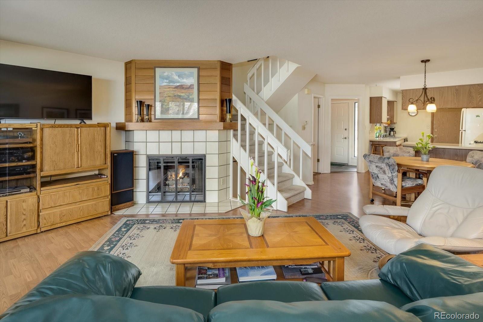 4635 Chestnut Lane, Unit 3 Boulder, CO 80301 - Photo 5 of 36 a living room with furniture and a flat screen tv