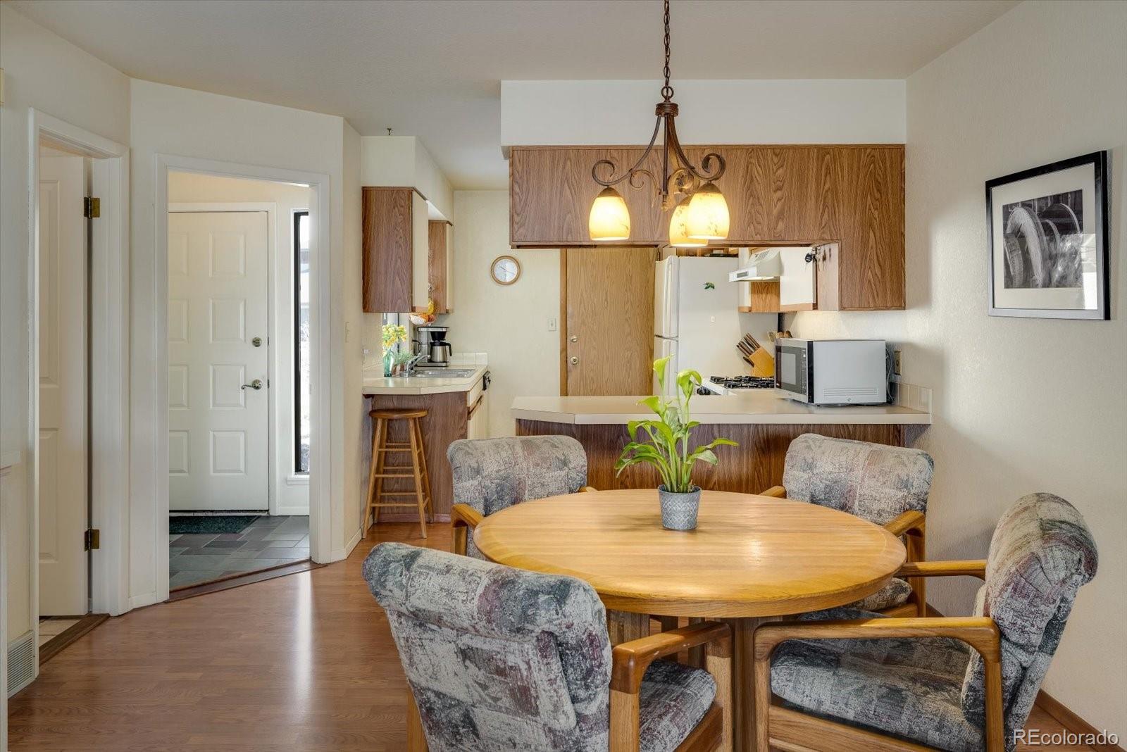 4635 Chestnut Lane, Unit 3 Boulder, CO 80301 - Photo 7 of 36 a view of a dining room with furniture