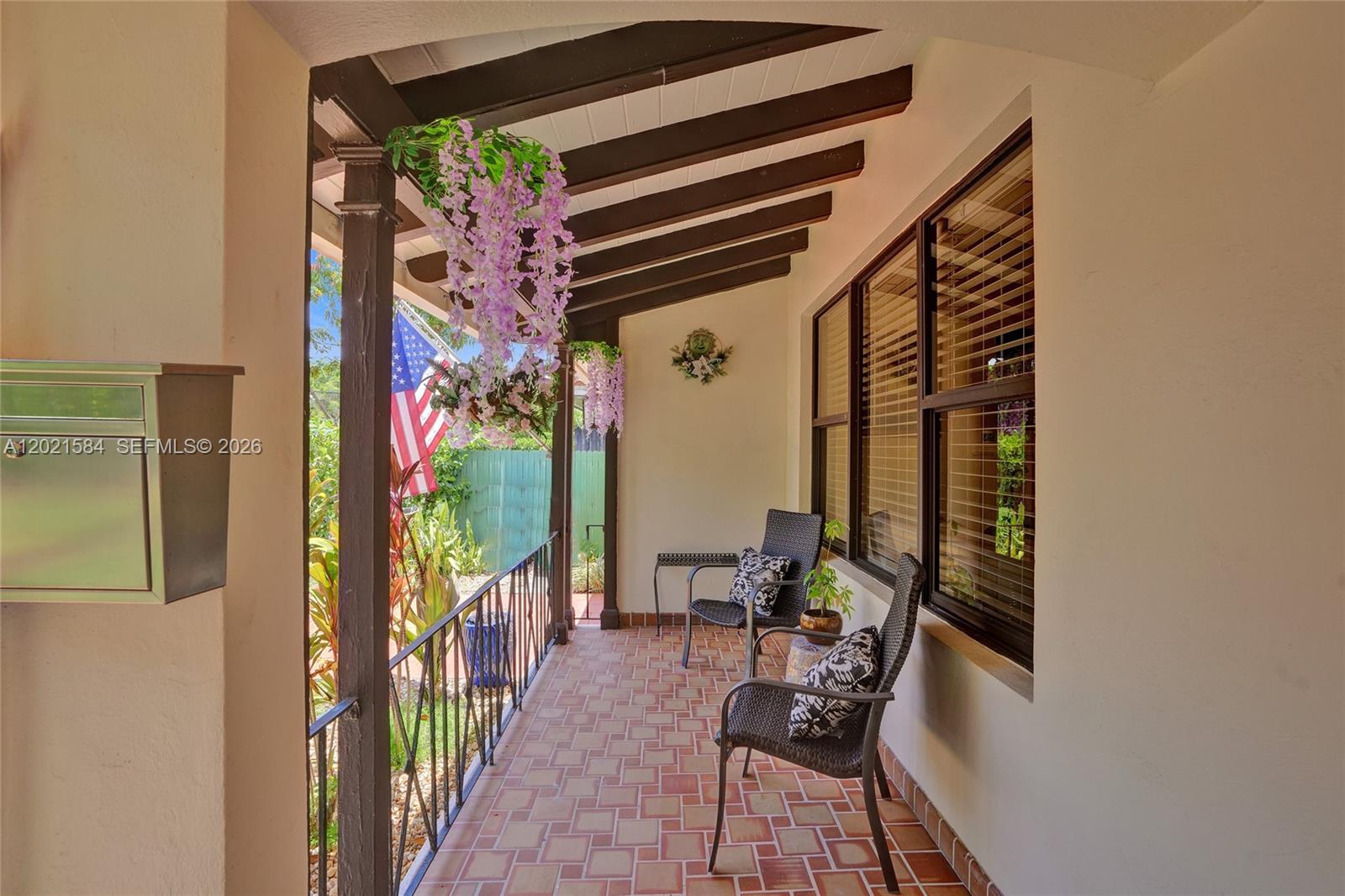 811 Northeast 73rd Street Miami, FL 33138 - Photo 6 of 51 a view of a porch with chairs and backyard