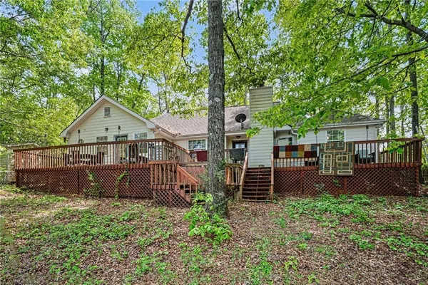 a lake view with large trees