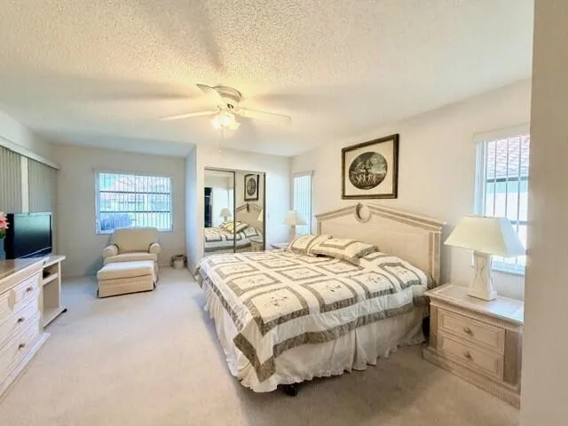 a bedroom with a bed and couch