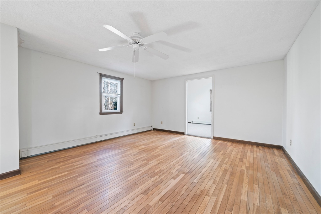 33 Oak Ridge Road Sandwich, MA 02537 - Photo 13 of 42 a view of an empty room with wooden floor and a window