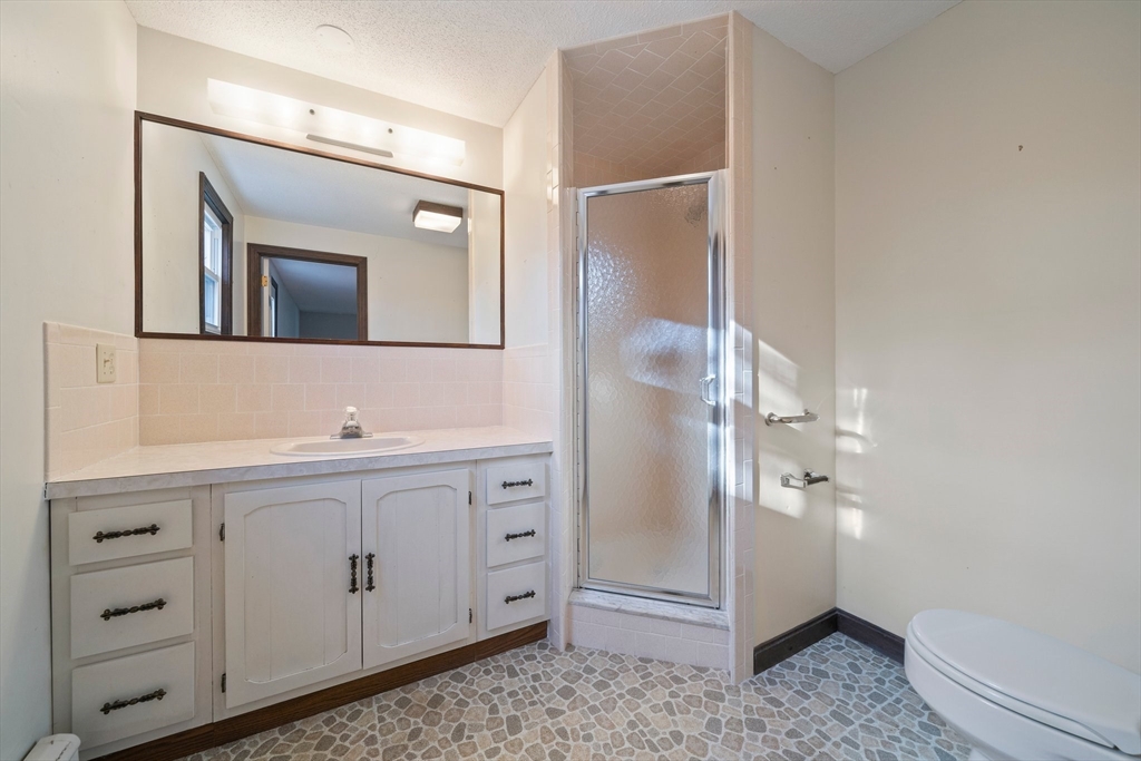 33 Oak Ridge Road Sandwich, MA 02537 - Photo 16 of 42 a bathroom with a double vanity sink mirror and toilet