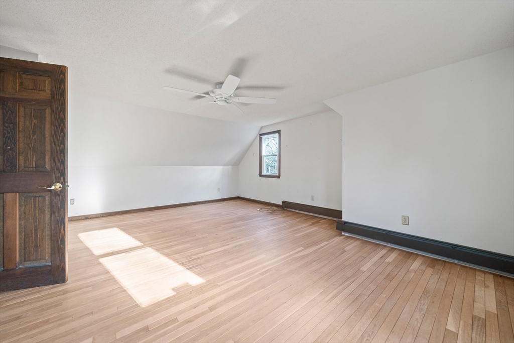 33 Oak Ridge Road Sandwich, MA 02537 - Photo 17 of 42 an empty room with wooden floor and windows