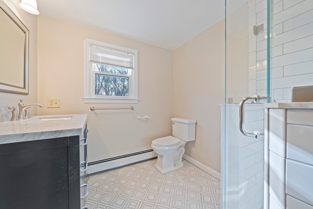 33 Oak Ridge Road Sandwich, MA 02537 - Photo 19 of 42 a bathroom with a toilet sink and shower