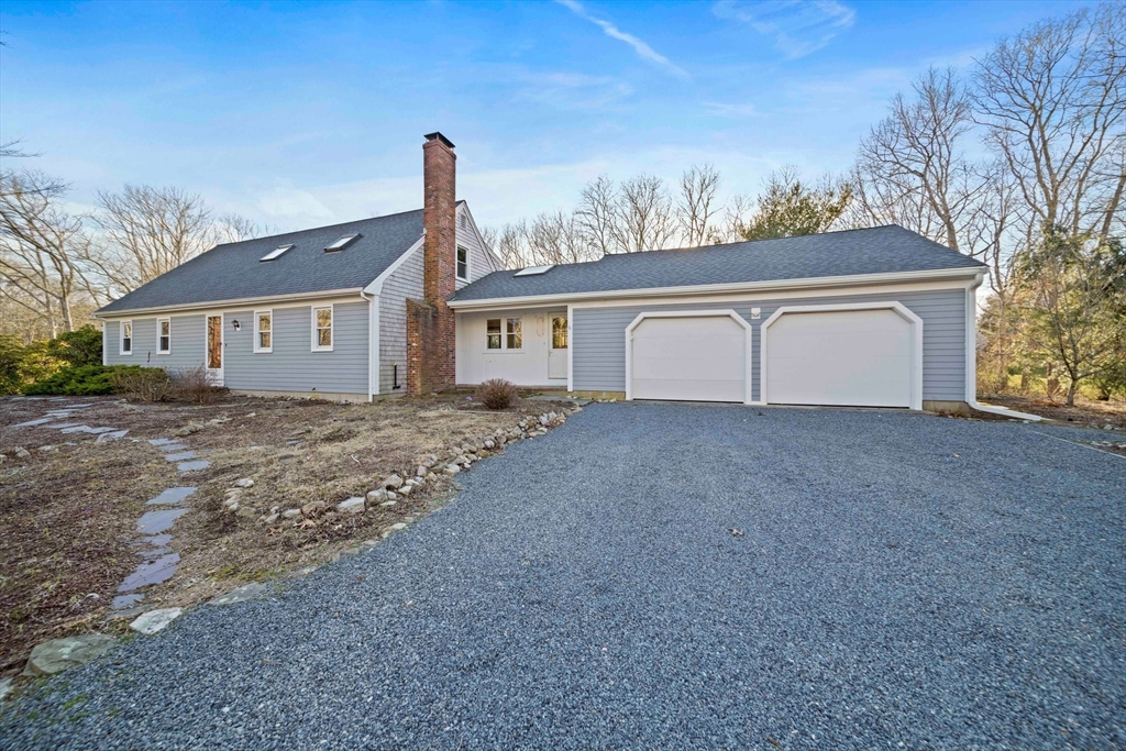33 Oak Ridge Road Sandwich, MA 02537 - Photo 2 of 42 front view of a house with a yard