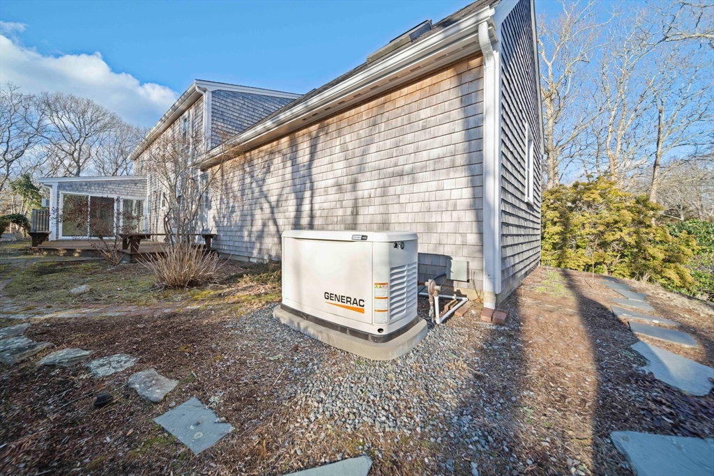 33 Oak Ridge Road Sandwich, MA 02537 - Photo 28 of 42 a backyard of a house with outdoor seating