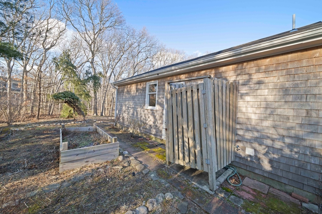 33 Oak Ridge Road Sandwich, MA 02537 - Photo 29 of 42 a view of a backyard with pathway