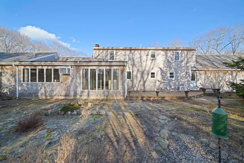33 Oak Ridge Road Sandwich, MA 02537 - Photo 30 of 42 a view of a house with backyard and sitting area