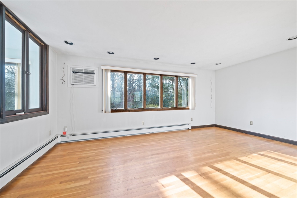 33 Oak Ridge Road Sandwich, MA 02537 - Photo 5 of 42 a view of an empty room with a window