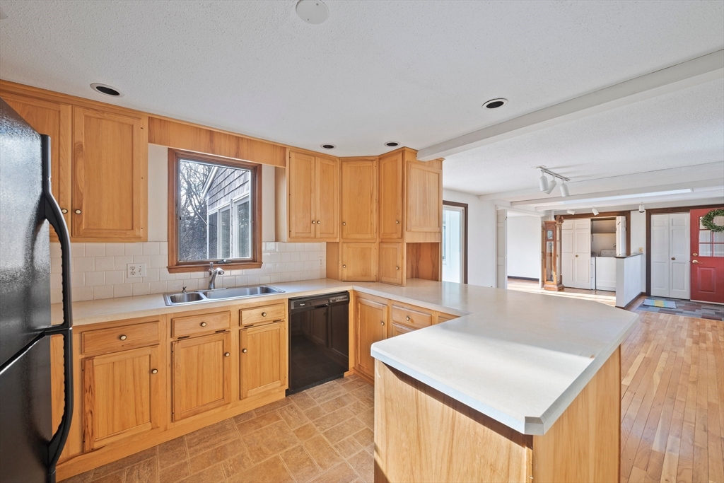 33 Oak Ridge Road Sandwich, MA 02537 - Photo 8 of 42 a kitchen with a sink stove and cabinets