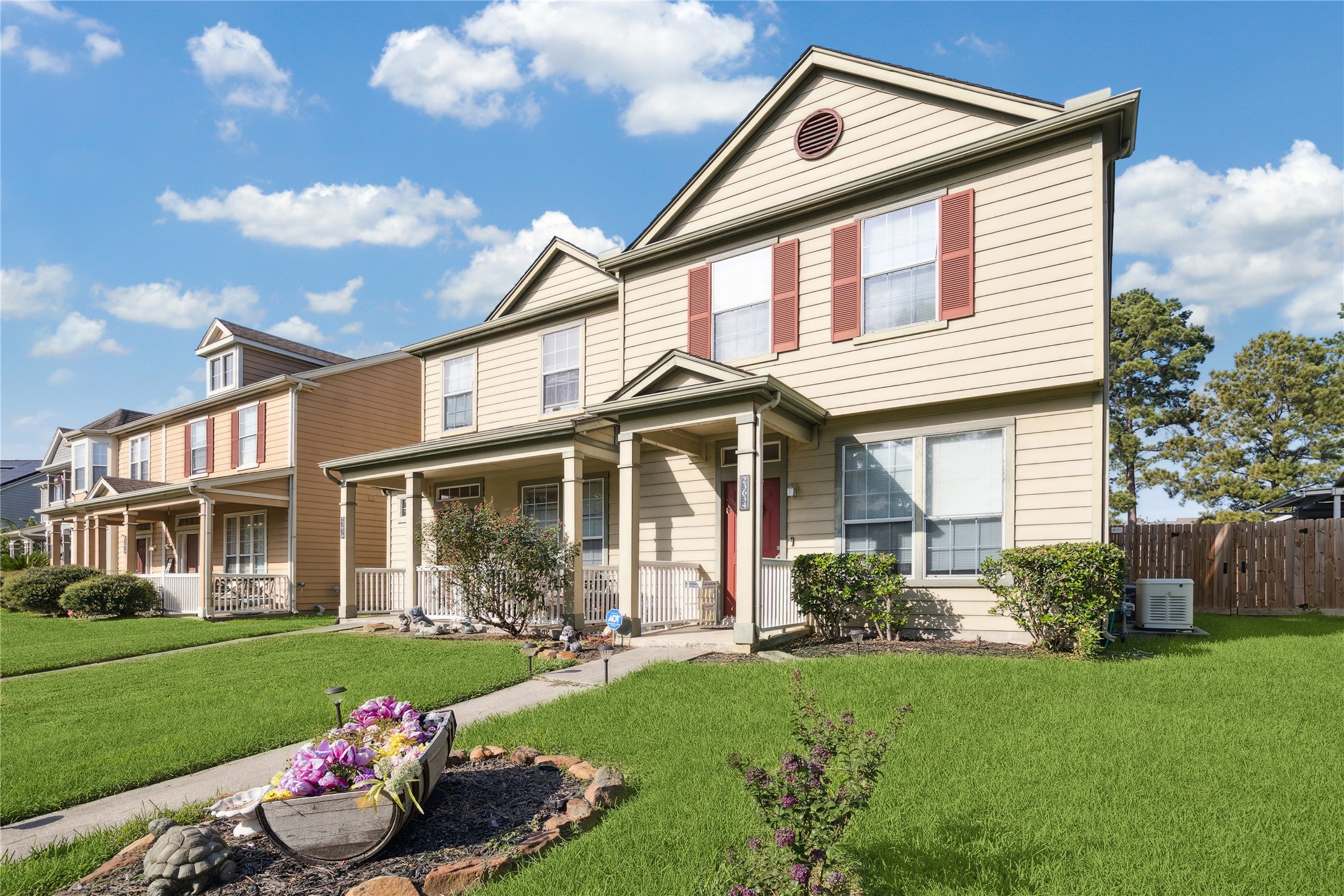 23634 Wildwood Green Way Spring, TX 77373 - Photo 14 of 14 a front view of a house with a yard and outdoor seating