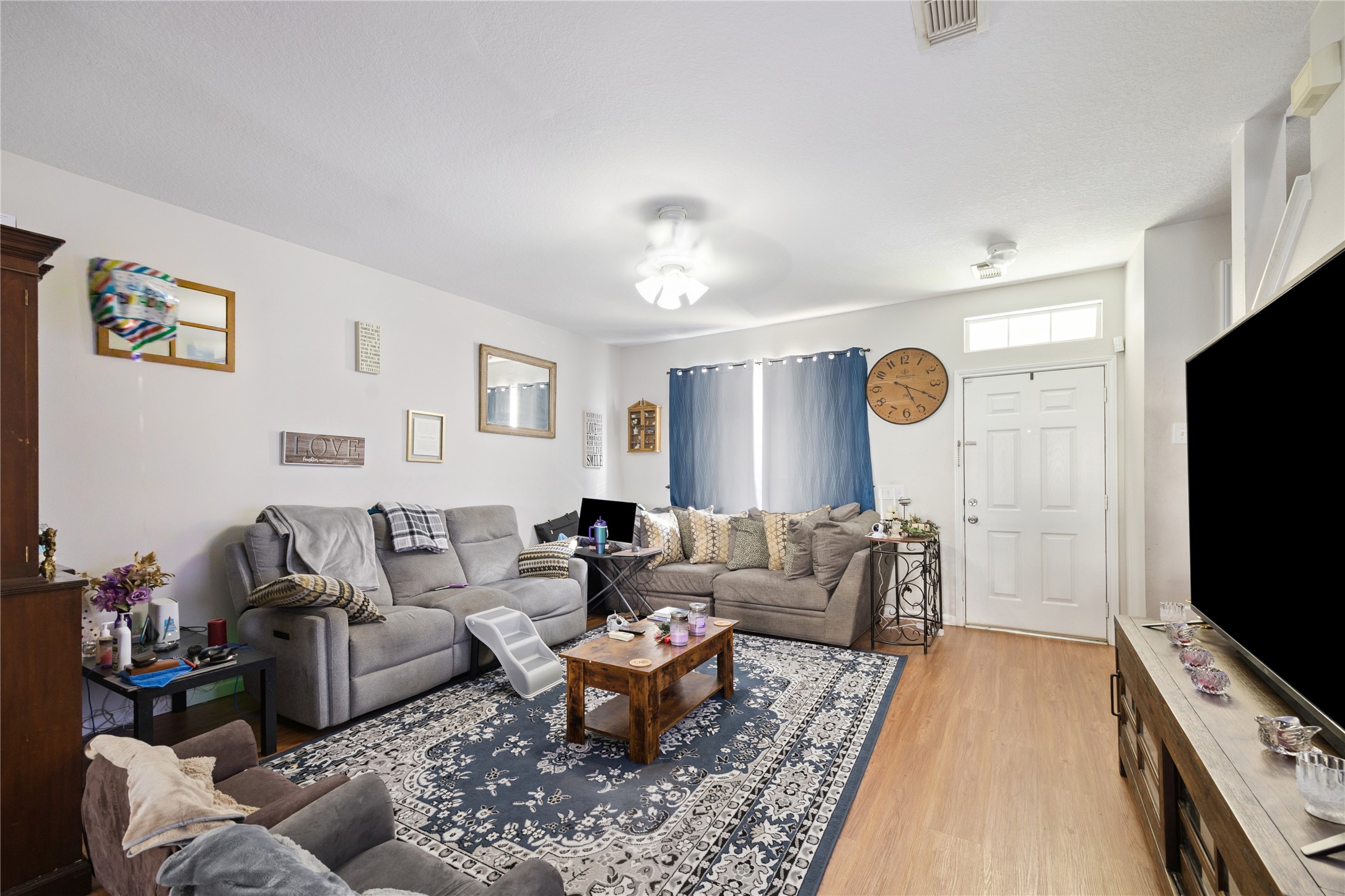 23634 Wildwood Green Way Spring, TX 77373 - Photo 2 of 14 a living room with furniture and a flat screen tv