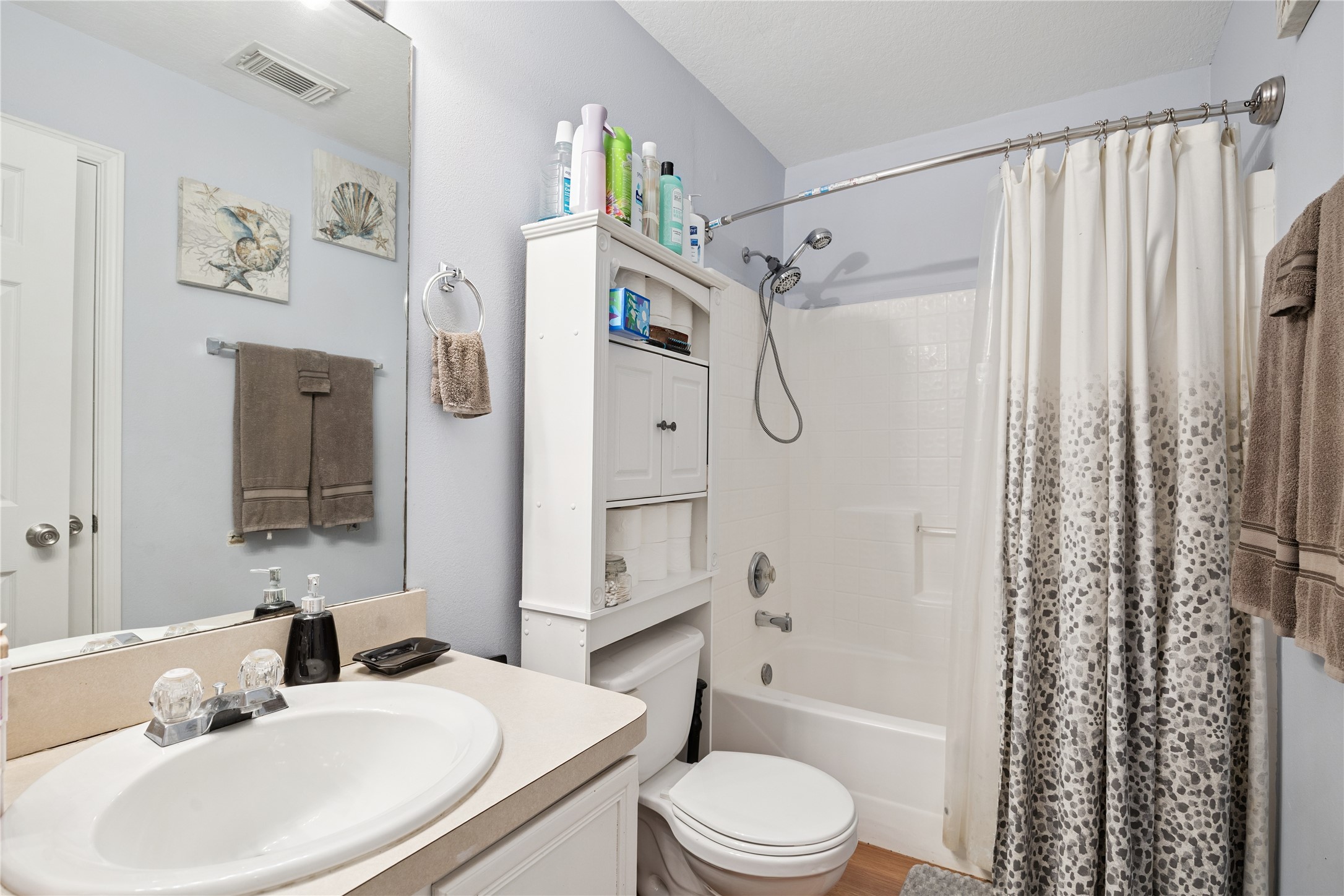 23634 Wildwood Green Way Spring, TX 77373 - Photo 7 of 14 a bathroom with a sink a toilet and shower