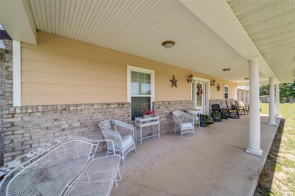 19355 Southwest 25th Place Dunnellon, FL 34431 - Photo 24 of 73 a view of a patio with couches and potted plants