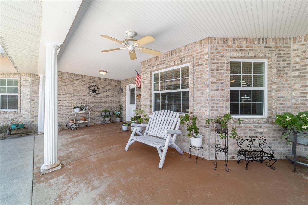 19355 Southwest 25th Place Dunnellon, FL 34431 - Photo 28 of 73 a balcony with furniture and potted plants