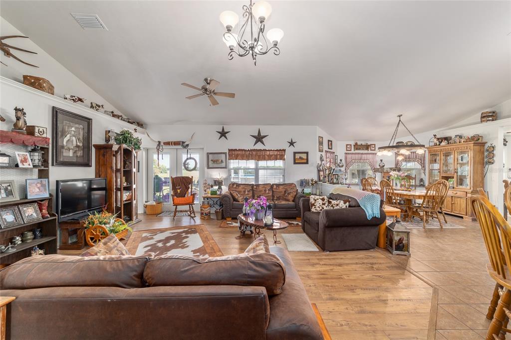 19355 Southwest 25th Place Dunnellon, FL 34431 - Photo 38 of 73 a living room with lots of furniture and a chandelier