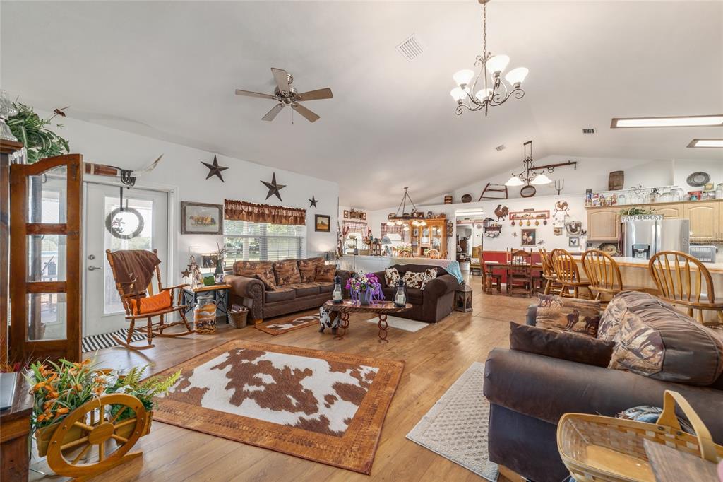 19355 Southwest 25th Place Dunnellon, FL 34431 - Photo 46 of 73 a living room with furniture kitchen and a chandelier