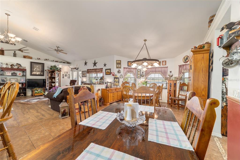 19355 Southwest 25th Place Dunnellon, FL 34431 - Photo 50 of 73 a living room with lots of furniture and a chandelier