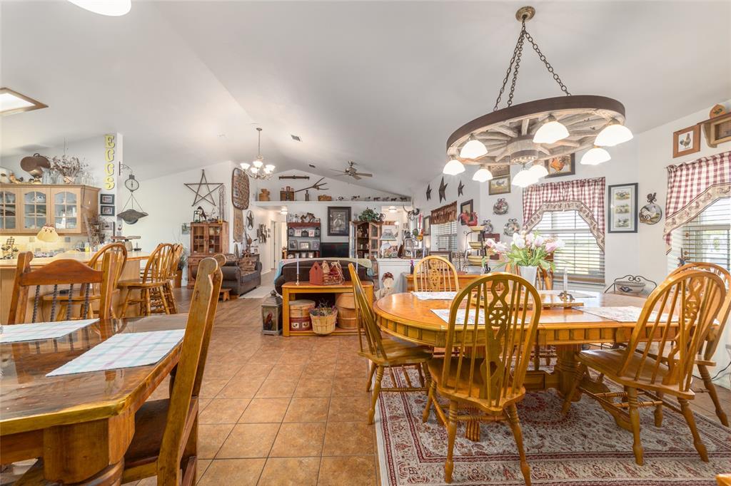 19355 Southwest 25th Place Dunnellon, FL 34431 - Photo 51 of 73 a view of a dining room with furniture and a chandelier