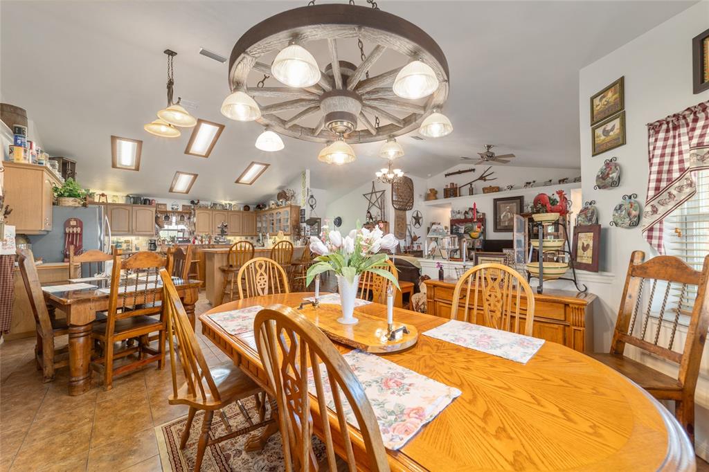 19355 Southwest 25th Place Dunnellon, FL 34431 - Photo 53 of 73 a view of a dining room with furniture and a chandelier
