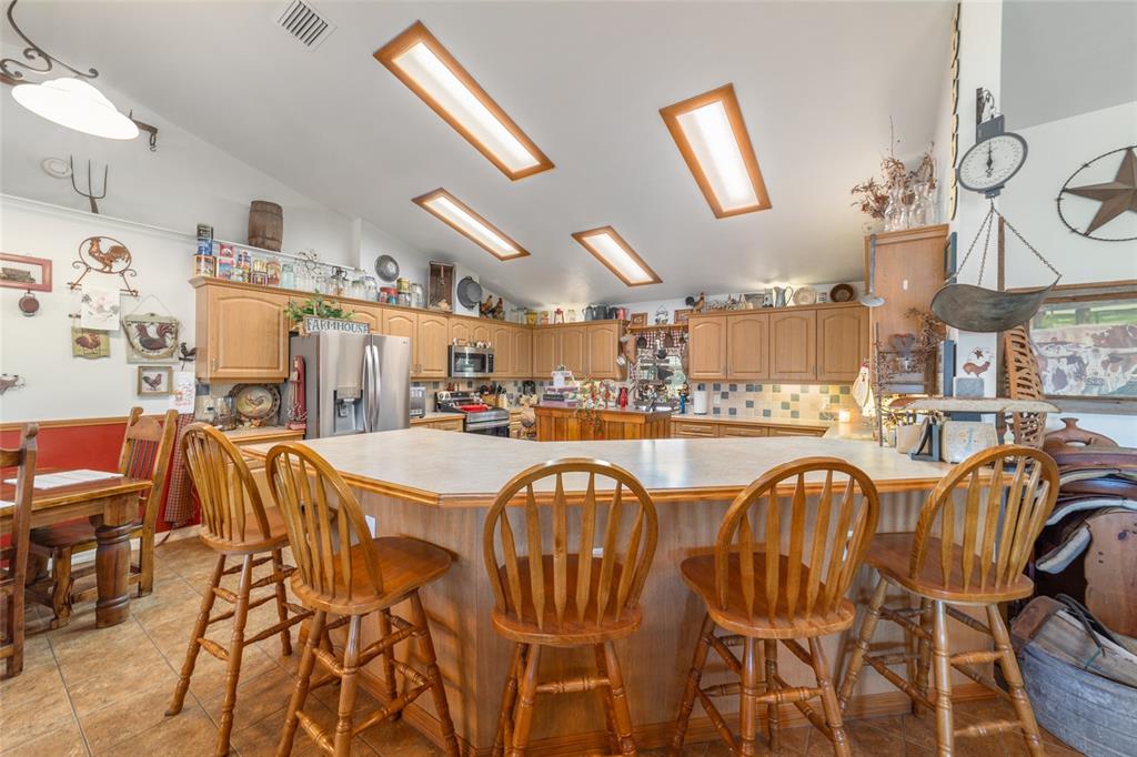19355 Southwest 25th Place Dunnellon, FL 34431 - Photo 57 of 73 a view of a dining room with furniture and a chandelier