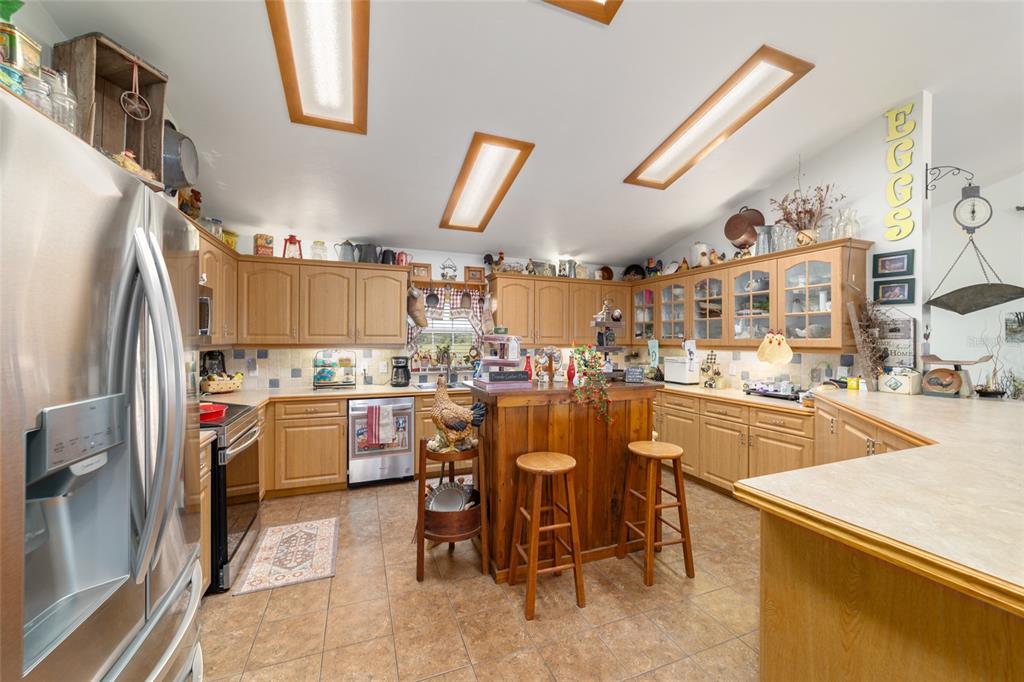 19355 Southwest 25th Place Dunnellon, FL 34431 - Photo 59 of 73 a kitchen with appliances cabinets and furniture