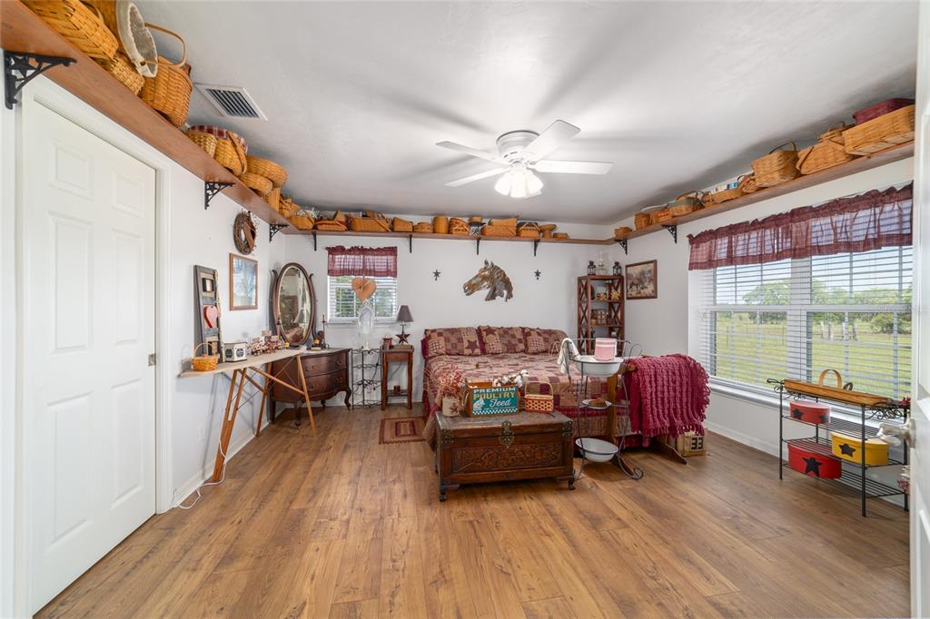 19355 Southwest 25th Place Dunnellon, FL 34431 - Photo 62 of 73 a bedroom with furniture and a large window