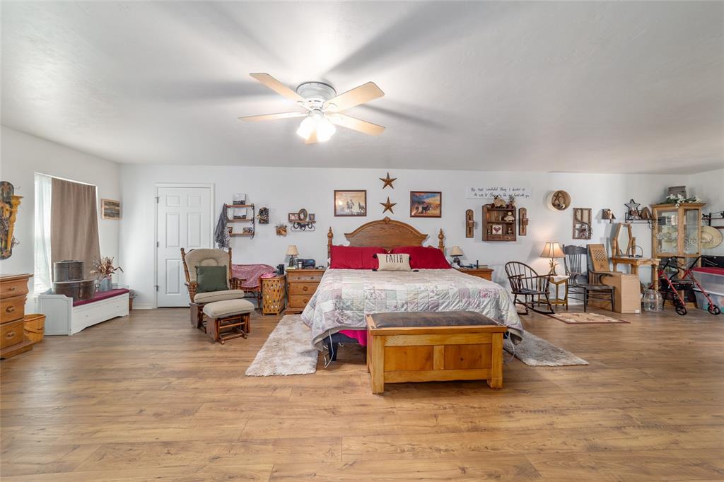 19355 Southwest 25th Place Dunnellon, FL 34431 - Photo 70 of 73 a bedroom with furniture and wooden floor