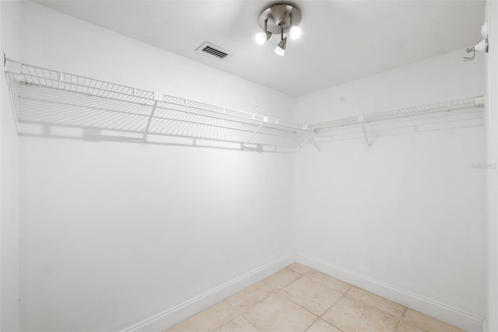 138 1st Street East, Unit 106 Tierra Verde, FL 33715 - Photo 27 of 62 a view of a room with racks on the wall