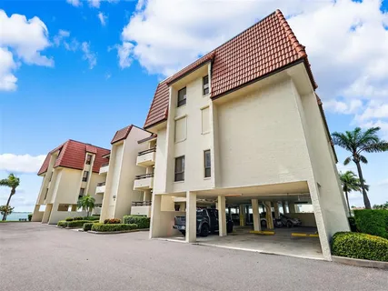 an aerial view of residential house with parking