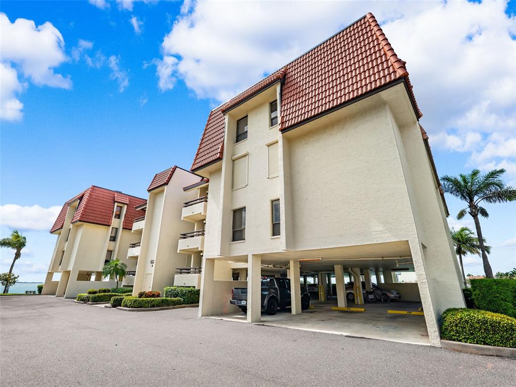 138 1st Street East, Unit 106 Tierra Verde, FL 33715 - Photo 44 of 62 a front view of a building with street view