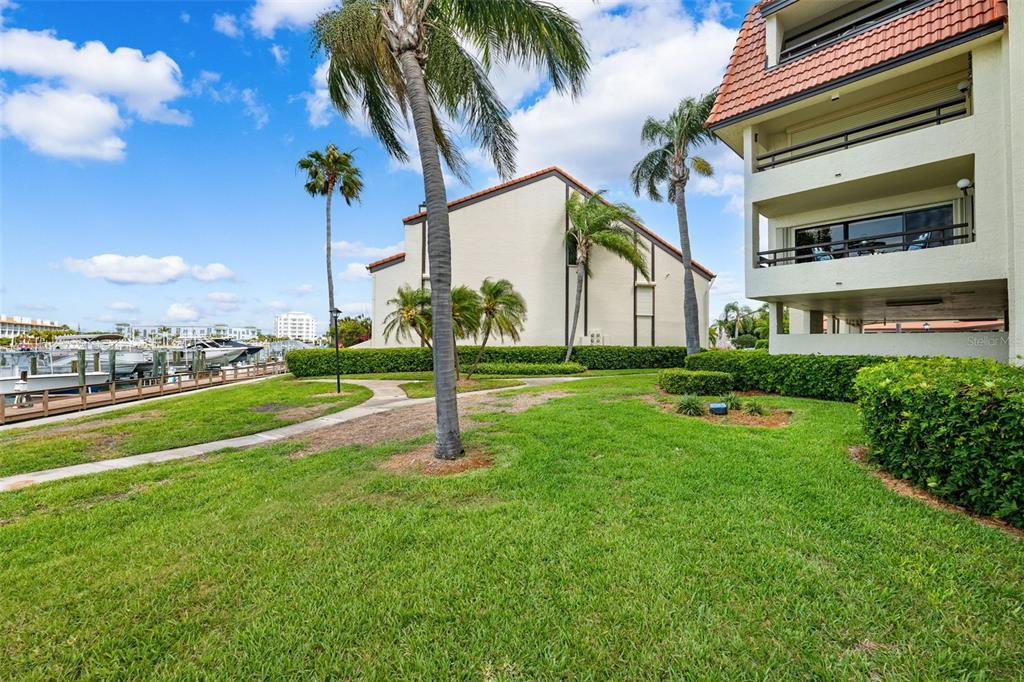 138 1st Street East, Unit 106 Tierra Verde, FL 33715 - Photo 45 of 62 a view of a house with a swimming pool