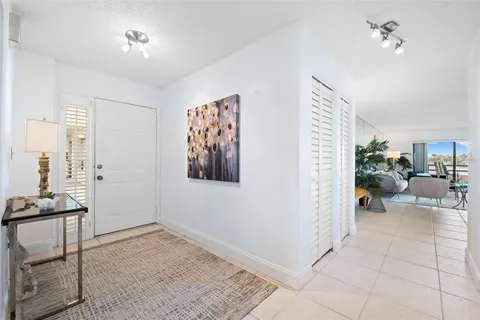 a view of a livingroom with workspace and a window