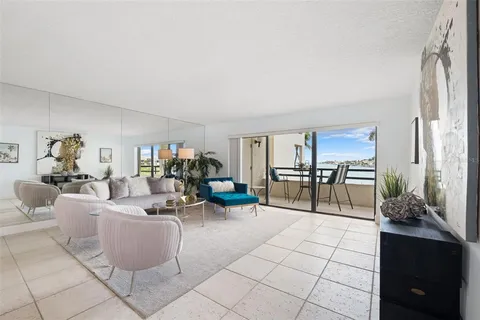 a living room with furniture and white walls