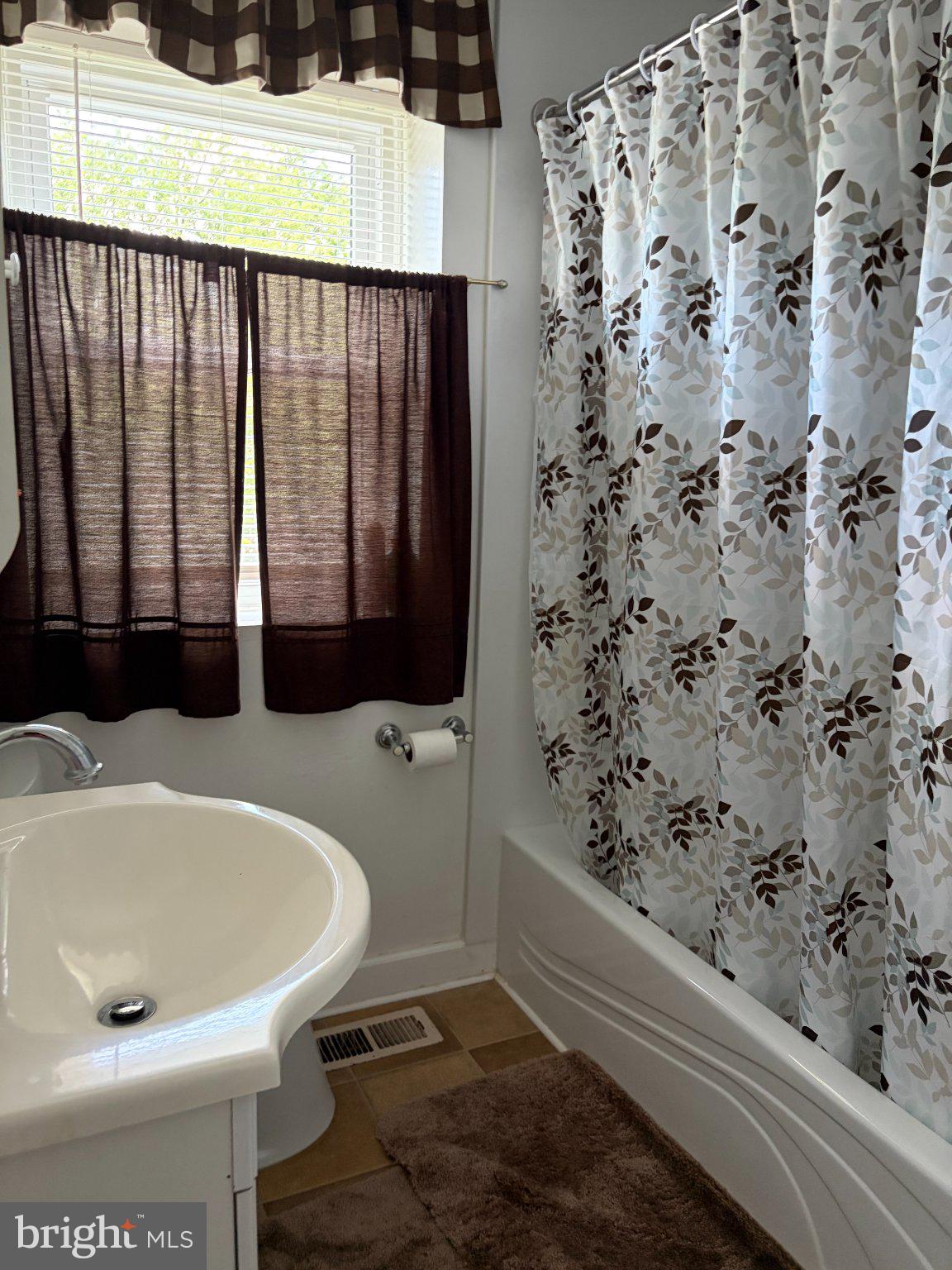 638 Kingston Road Middle River, MD 21220 - Photo 13 of 18 Charming bathroom with natural light.