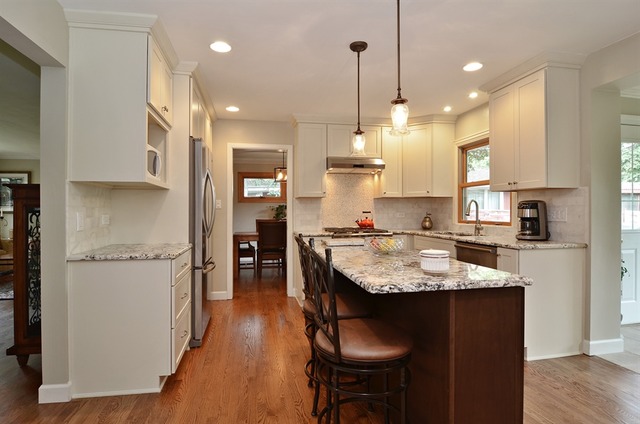 1341 South Knight Avenue Park Ridge, IL 60068 - Photo 4 of 10 a kitchen with kitchen island granite countertop a sink a center island stainless steel appliances and cabinets