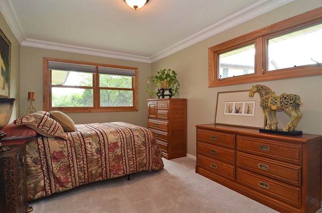 1341 South Knight Avenue Park Ridge, IL 60068 - Photo 7 of 10 a bedroom with a bed and wooden floor