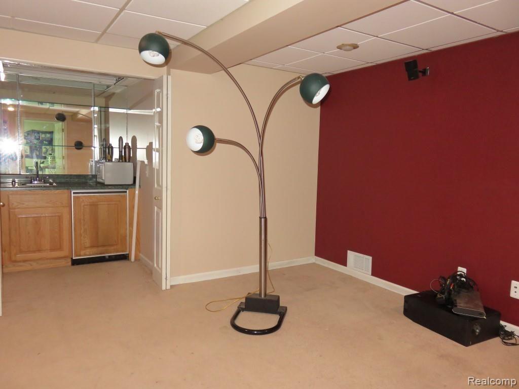 2611 Pinckney Road Howell, MI 48843 - Photo 30 of 55 Lower level walkout 18 x 15 bonus room with wet bar