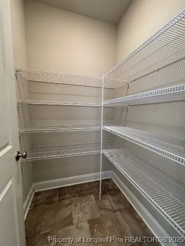 an empty room with a empty space and a window