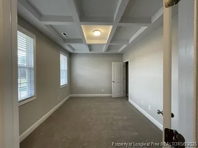 an empty room with a empty space and a ceiling fan