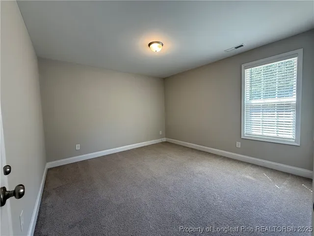 a kitchen with stainless steel appliances granite countertop a refrigerator a sink a stove a microwave and wooden cabinets