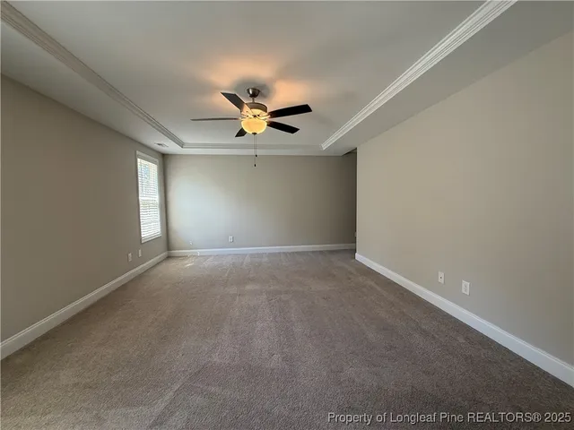 a kitchen with granite countertop a sink a stove and cabinets